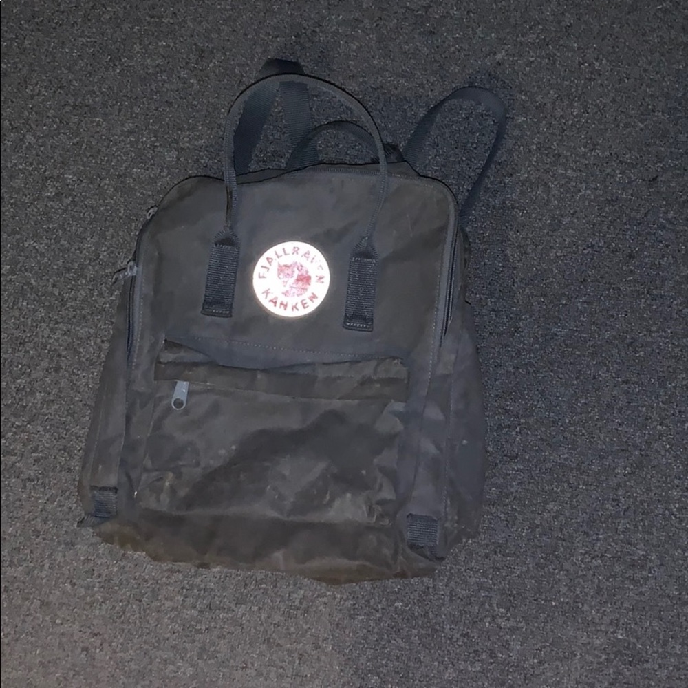a Fjallraven Kanken backpack